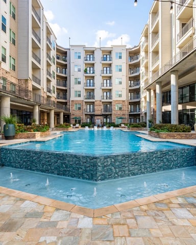 Courtyard with spa and swimming pool surrounded by multi-story residential buildings with balconies